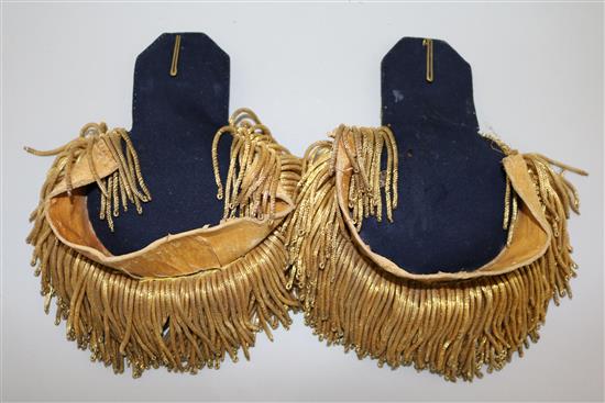 A pair of early 20th century Prussian gold braid epaulettes and a bronze bust of a Prussian Hussar commander, 11in.